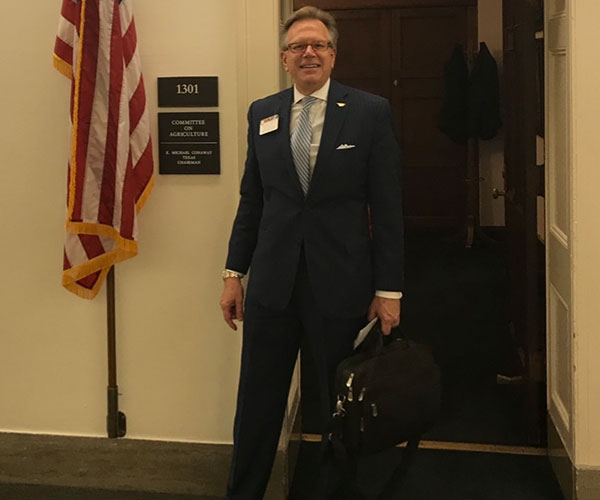 founder walking out of a government office